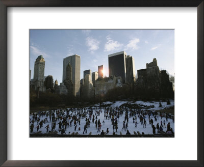 Elevated View Of Ice Skaters In Central Park And Of The Surrounding Cityscape by Ira Block Pricing Limited Edition Print image