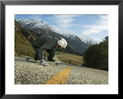 Man Going Down Hill On Longboard Skate, Treble Cone, Wanaka, New Zealand by Christian Aslund Pricing Limited Edition Print image