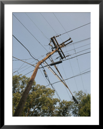 Tangled Wires Stretch In Four Directions From A Telephone Pole by Sam Kittner Pricing Limited Edition Print image