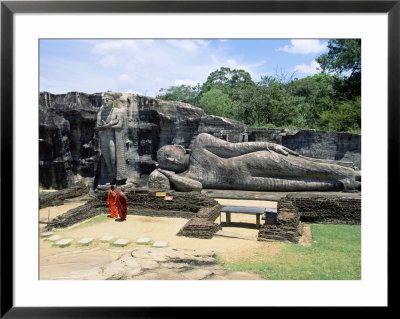 Two Monks In Front Of Buddha Statue, Gal Vihara, Polonnaruwa, Unesco World Heritage Site, Sri Lanka by Yadid Levy Pricing Limited Edition Print image