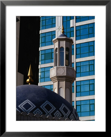 Minaret Of Mosque And Office Building, Dubai, United Arab Emirates by Tony Wheeler Pricing Limited Edition Print image