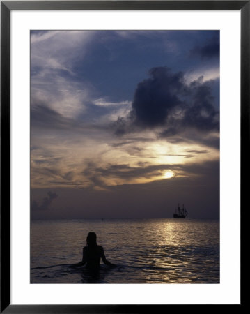 Woman Looking At Tall Ship, Cayman Islands by Bruce Clarke Pricing Limited Edition Print image