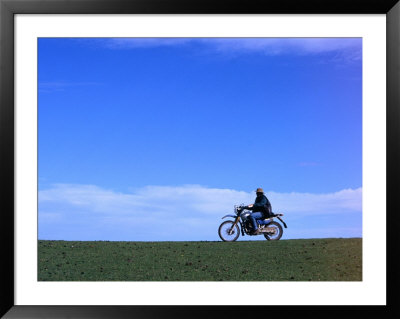 Local Farmer Riding Motorbike Across Paddock, Seymour, Australia by Will Salter Pricing Limited Edition Print image