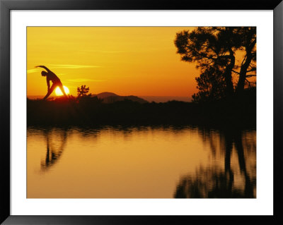 Woman Stretching During Yoga With Setting Sun by Kate Thompson Pricing Limited Edition Print image