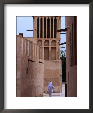 Man Walking In Lanes Of Bastikia Quarter, Dubai, United Arab Emirates by Phil Weymouth Pricing Limited Edition Print image