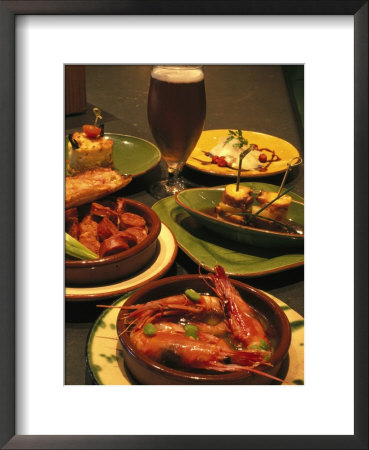 Several Dishes Of Tapas And A Beer In A Spanish Restaurant by Richard Nowitz Pricing Limited Edition Print image