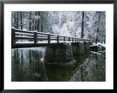 A Snow-Covered Footbridge Spanning The Merced River by Marc Moritsch Pricing Limited Edition Print image