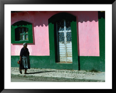 Elderly Woman Walking Past Pink And Green Building, Chiapas, Mexico by Eric Wheater Pricing Limited Edition Print image