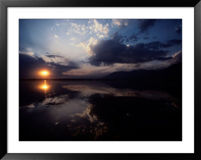 Sunset Sky Filled With Clouds Is Reflected In The Water by Sam Abell Pricing Limited Edition Print image