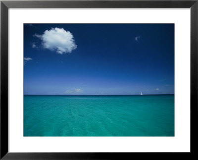 A Sailboat Plies A Clear Blue Sea Under Sky With A Single Cloud by Steve Winter Pricing Limited Edition Print image