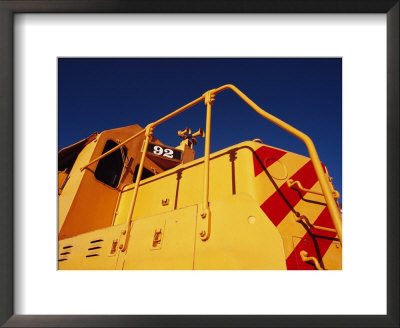 A Bright Yellow Train Engine by Raul Touzon Pricing Limited Edition Print image