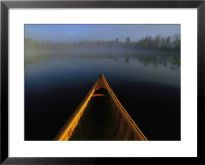 A Canoes Bow On Black Lake In Early Morning Light by Maria Stenzel Pricing Limited Edition Print image