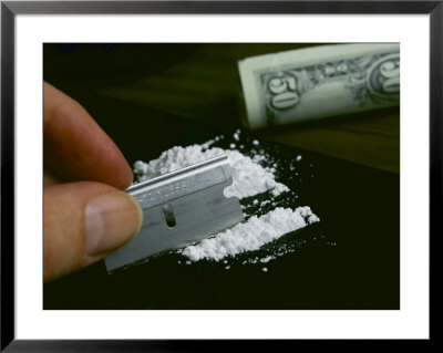 A Hand Dividing Up A Pile Of Cocaine With A Razor Blade by Todd Gipstein Pricing Limited Edition Print image