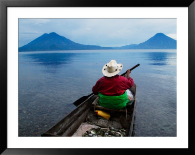 Man On Canoe In Lake Atitlan, Volcanoes Of Toliman And San Pedro Pana Behind, Guatemala by Keren Su Pricing Limited Edition Print image