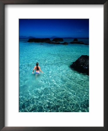 Woman Wading In Sea Off Ko Kham, Thailand by Woods Wheatcroft Pricing Limited Edition Print image