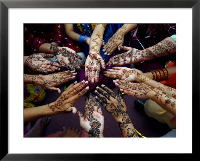 Pakistani Girls Show Their Hands Painted With Henna Ahead Of The Muslim Festival Of Eid-Al-Fitr by Khalid Tanveer Pricing Limited Edition Print image