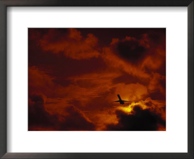 Silhouette Of Airplane In Flight At Sunset by Roger Holden Pricing Limited Edition Print image