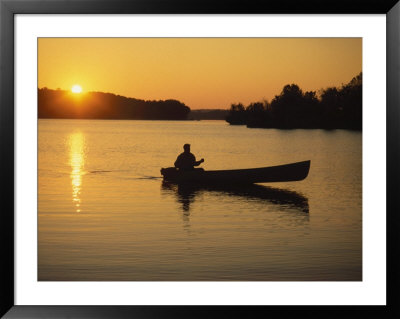 Georgia, Canoe On A Lake At Sunrise by Jennifer Broadus Pricing Limited Edition Print image
