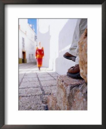 Woman Approaching Man Sitting On Step In Lane, Nerja, Spain by Philip & Karen Smith Pricing Limited Edition Print image