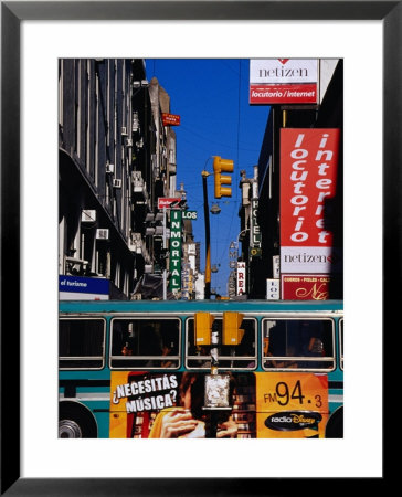Bus On Lavalle St, Pedestrian Mall In Microcentro, Buenos Aires, Argentina by Krzysztof Dydynski Pricing Limited Edition Print image