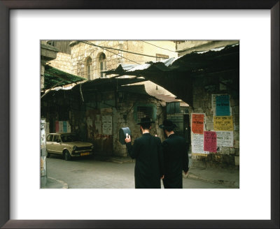 Two Orthodox Jews Walk Through Mea Shearim Near Old Jerusalem by Joel Sartore Pricing Limited Edition Print image