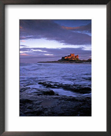 Bamburgh Castle At Dusk, Northumberland, England by Gary Cook Pricing Limited Edition Print image