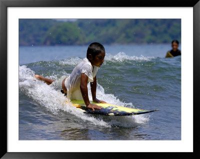 Boy Learning To Surf, Morro Negrito, Panama by Paul Kennedy Pricing Limited Edition Print image