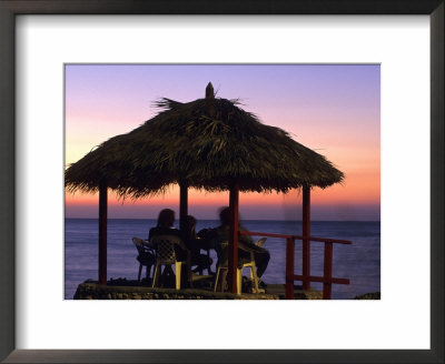 Cliffside Table At Pickled Parrot At Sunset, Negril, Jamaica by Holger Leue Pricing Limited Edition Print image