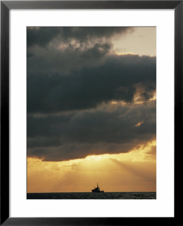 The Sun Shines Through The Clouds Over The Atlantic Ocean by Emory Kristof Pricing Limited Edition Print image