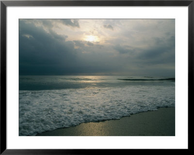 Dramatic View Of A Stormy Sunrise And The Foamy Surf by Brian Gordon Green Pricing Limited Edition Print image