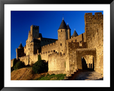 Tourists Enter Medieval Walled City At Sundown Via Porte D'aude, Carcassonne, France by Dallas Stribley Pricing Limited Edition Print image