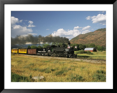 Old Locomotive With Billowing Black Smoke In Hilly Countryside by Richard Nowitz Pricing Limited Edition Print image