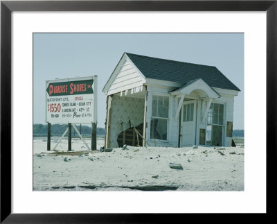 Sign Advertising A Housing Development Being Built Next To A Storm-Damaged Cottage by B. Anthony Stewart Pricing Limited Edition Print image