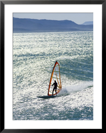 Windsurfer Silhouetted In The Sun On A Wave Off Punta San Carlos by Skip Brown Pricing Limited Edition Print image