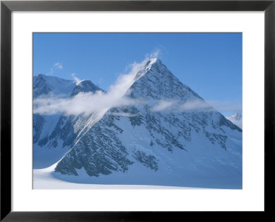 A Cloud Passes By Windblown Pyramid Peak, In Antarctica by Gordon Wiltsie Pricing Limited Edition Print image