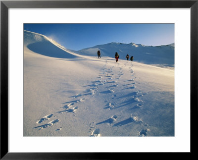 Hiking Across The Snow-Swept Volcanic Landscape Of Iceland Near Glymsgil by Bill Hatcher Pricing Limited Edition Print image