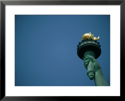 A Close View Of The Torch Held By The Statue Of Liberty by Joel Sartore Pricing Limited Edition Print image