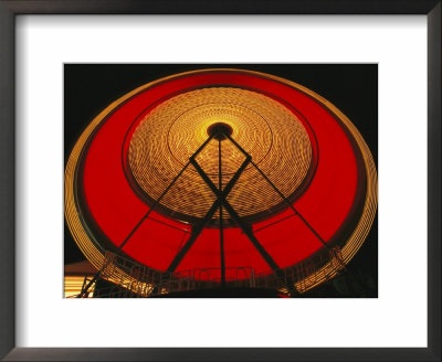 Time Exposure Of A Whirling Lighted Carnival Ride At Night by Heather Perry Pricing Limited Edition Print image