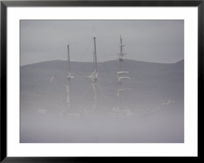 Fog Shrouds A Boat In The Early Morning by Bill Curtsinger Pricing Limited Edition Print image