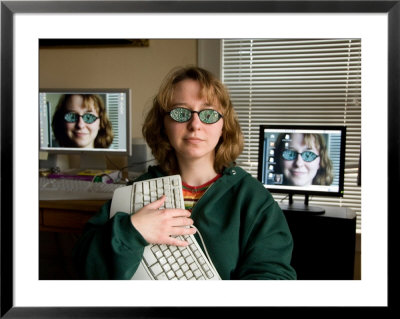 A Female Wears Circuit Glasses In Front Of Two Computer Monitors by Joel Sartore Pricing Limited Edition Print image