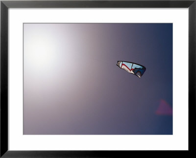 A Kite Surfing Sail In A Clear Blue Sky With Sunlight by Jason Edwards Pricing Limited Edition Print image