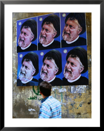 Passerby Looking At Political Posters On Wall, Tyre, Lebanon by Bethune Carmichael Pricing Limited Edition Print image