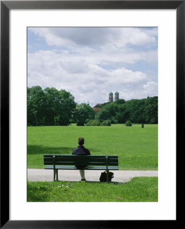 Man Sits In The English Garden In Munich by Taylor S. Kennedy Pricing Limited Edition Print image