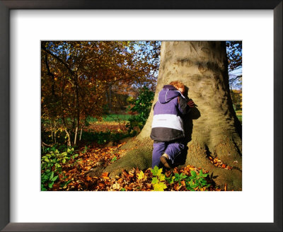Boy Playing Hide-And-Seek In Frederiksberg, Copenhagen, Denmark by Martin Lladó Pricing Limited Edition Print image