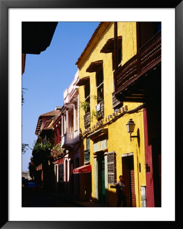 Colonial Facades In Street, Cartagena, Colombia by Wayne Walton Pricing Limited Edition Print image