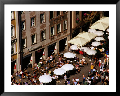 Overhead Of Outdoor Cafes On Marienplatz, Munich, Germany by Krzysztof Dydynski Pricing Limited Edition Print image