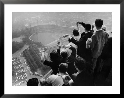University Of Pittsburgh Students Cheering Wildly From Atop Cathedral Of Learning On School Campus by George Silk Pricing Limited Edition Print image