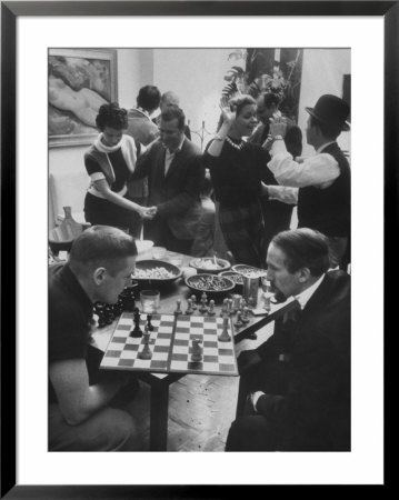 Men Playing Chess At A Cocktail Party by Francis Miller Pricing Limited Edition Print image