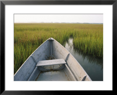 The Bow Of A Rowboat Slices Through The Marsh Grass by Skip Brown Pricing Limited Edition Print image