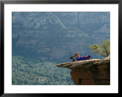 A Hiker Resting At A Cliffs Edge by Dugald Bremner Pricing Limited Edition Print image